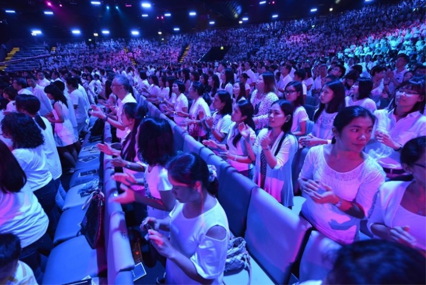 Thousands of churchgoers dressed in white at Faith Community Baptist Church in Singapore on June 29, 2014 to 