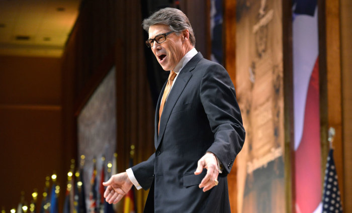 Texas Gov. Rick Perry greets guests as he arrives at the Conservative Political Action Conference (CPAC) opens in Oxon Hill, Maryland, March 7, 2014. Thousands of conservative activists, Republicans and Tea Party Patriots gather to hear politicians, presidential hopefuls, and business leaders speak, lobby and network for a conservative agenda, looking to Congressional gains in 2014 and a Republican president in 2016.