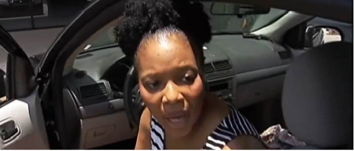 Michelle Griffith alleges that an off-duty officer spit on her and called her a racial slur.