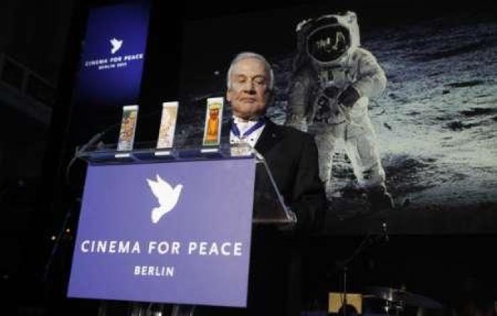 Apollo astronaut Buzz Aldrin addresses the audience during the 'Cinema for Peace 2011' charity gala at the 61st Berlinale film festival in Berlin February 14, 2011.