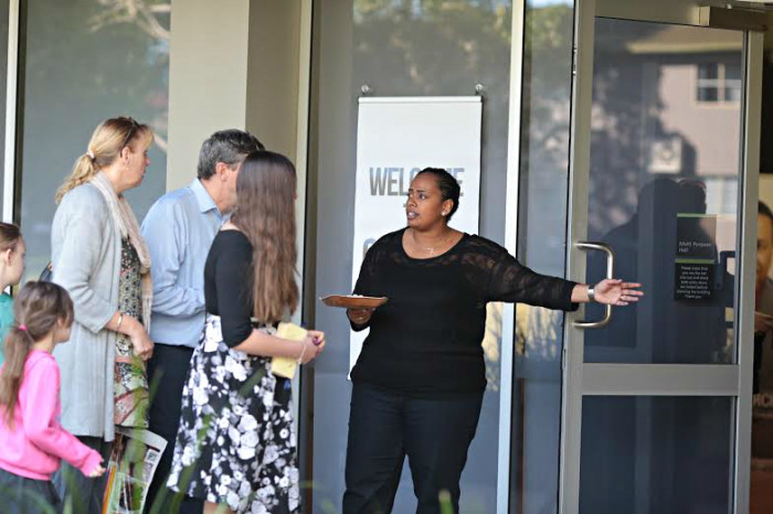 A greeter welcomes visitors to the World Changers Church International Gold Coast service on Sunday, June 22, 2014, on the Gold Coast in Queensland, Australia.