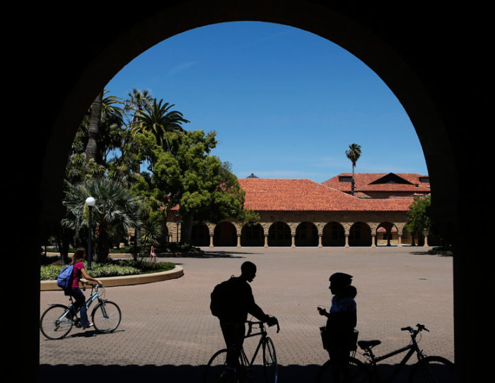 Students retrieve their bicycles after leaving a class, at the Main Quad at Stanford University in Stanford, California, May 9, 2014.