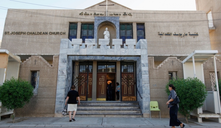 Iraqi Christians enter the St. Joseph Chaldean Church to attend a mass, in Baghdad July 20, 2014. The head of Iraq's largest church said on Sunday that Islamic State militants who drove Christians out of Mosul were worse than Mongol leader Genghis Khan and his grandson Hulagu who ransacked medieval Baghdad. Chaldean Catholic Patriarch Louis Raphael Sako led a wave of condemnation for the Sunni Islamists who demanded Christians either convert, submit to their radical rule and pay a religious levy or face death by the sword