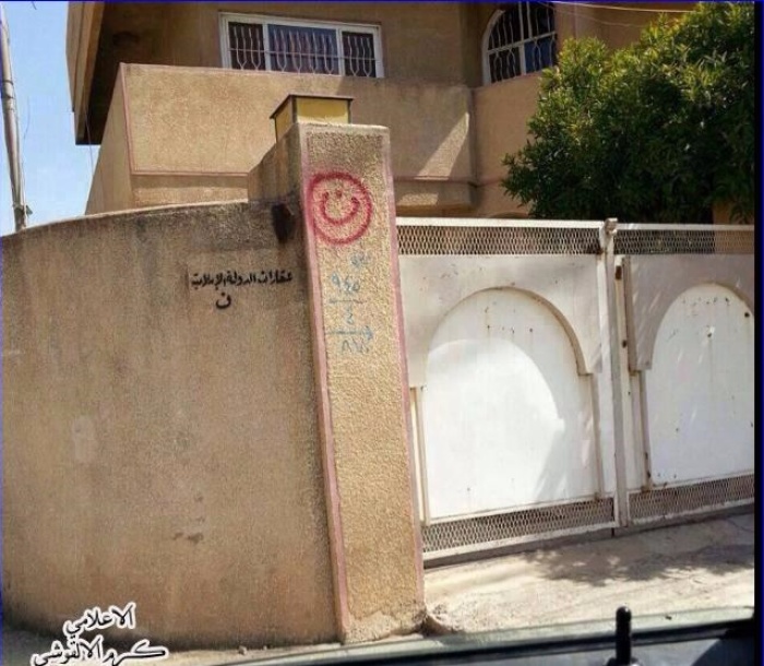 The Arabic letter 'n' (inside red circle), signifying 'Nasarah' (Christian), on a Christian home in Mosul.