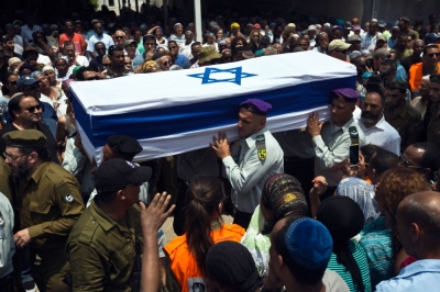 The flag covered coffin of Israeli soldier Bayhesain Kshaun, 39, who was killed on July 21, is carried during his funeral in the southern town of Netivot July 22, 2014. Israel pounded targets across the Gaza Strip on Tuesday, saying no ceasefire was near as top U.S. and U.N. diplomats pursued talks on halting fighting that has claimed more than 600 lives. With the conflict entering its third week, the Palestinian death toll rose to 603, including nearly 100 children and many other civilians, Gaza health officials said. Israel's casualties also mounted, with the military announcing the deaths of two more soldiers, bringing the number of army fatalities to 27 - almost three times as many as were killed in the last ground invasion of Gaza, in a 2008-2009 war.