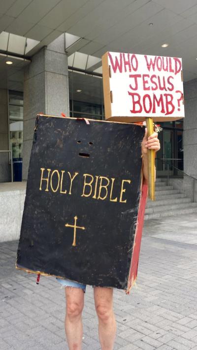 Protesters with the Code Pink activist group wear Bibles to show their opposition to Israel's bombing of the Gaza Strip.