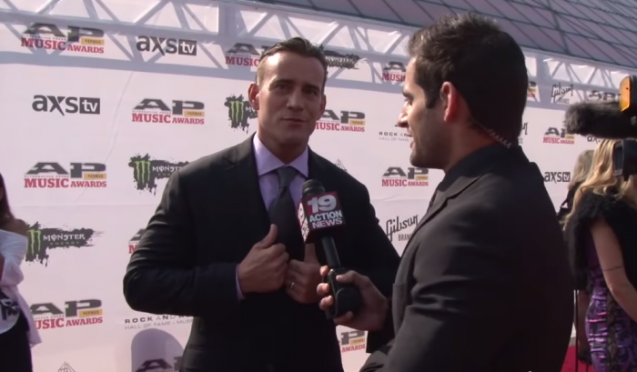 Former World Wrestling Entertainment superstar CM Punk talking with Chris Van Vliet of CBS-19 at the 2014 AP Music Awards at the Rock and Roll Hall of Fame in Cleveland.