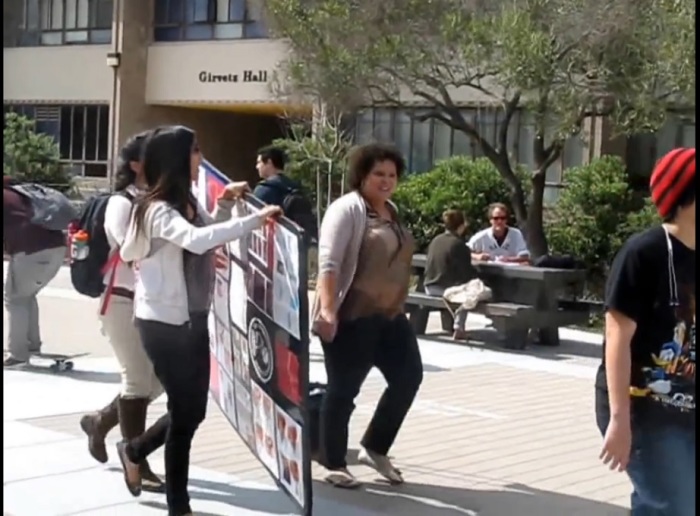 UC Santa Barbara professor of Feminist Studies, Mireille Miller-Young (R), captured taking a pro-life poster in an incident on March 4, 2014