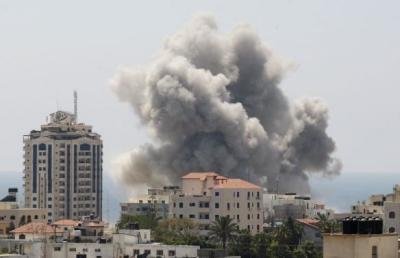 Smoke rises following what witnesses said was an Israeli air strike in Gaza City July 27, 2014.