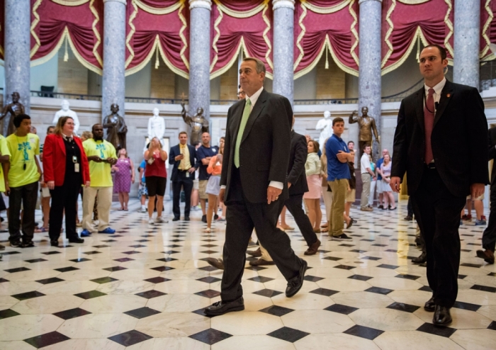 Speaker of the House John Boehner (R-OH) walks from his office to the House Chamber during a procedural vote at the Capitol in Washington August 1, 2014. A bill to fund border security blew up in House Speaker John Boehner's face on Thursday, leaving Republicans in disarray and struggling to reconcile Tea Party demands with the need to deal with a humanitarian crisis on the southwestern border with Mexico.