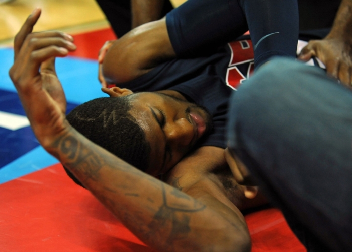 USA Team Blue guard Paul George lays on the floor after injuring his leg during the USA Basketball Showcase at Thomas & Mack Center.