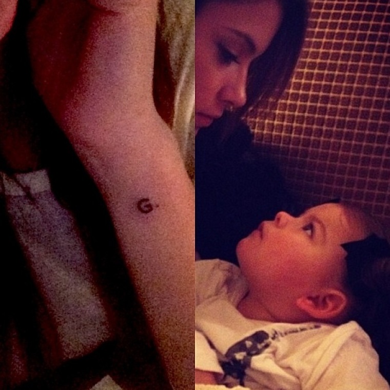 Actress Ashley Benson shows her 'G' tattoo.