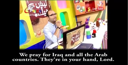 "Mr. Know" from SAT-7 KIDS listens as Mario, a regular fan of his show, called the studio last week from his hometown in Egypt to pray for Iraq and all the Arab countries, (FILE).