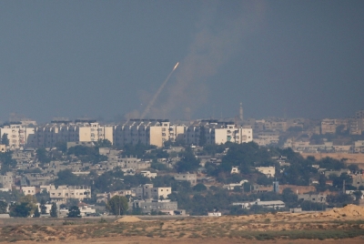 A smoke trail is seen as a rocket is launched towards Israel from the northern Gaza Strip July 11, 2014. Israel pressed on for a fourth day with its Gaza offensive on Friday, striking the Hamas-dominated enclave from air and sea, as Palestinian militants kept up rocket attacks deep into the Jewish state. At least 79 Palestinians, most of them civilians, have been killed in the offensive, which Israel says it launched to end persistent rocket attacks on its civilian population, some of which have reached Tel Aviv, Jerusalem and other cities.