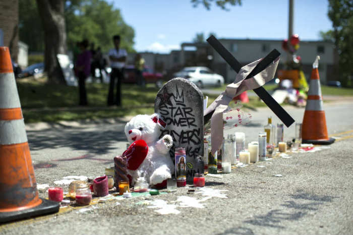 A makeshift memorial is pictured where black teenager Michael Brown was shot to death by police last weekend in Ferguson, Missouri August 13, 2014.