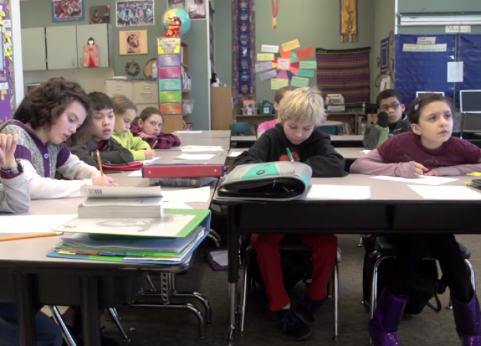 YouTube Screencap: Grade-schoolers with different racial backgrounds.