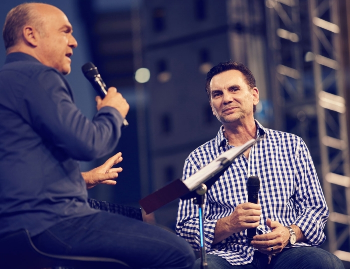 Evangelist Greg Laurie interviews former mobster Michael Franzese at the SoCal Harvest event on Friday, August 15, 2014, at the Angel Stadium in Anaheim, California, where 28,000 people attended and thousands more watched online.