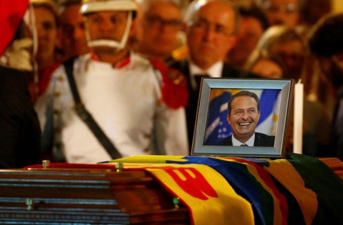 A portrait of the late Brazilian presidential candidate Eduardo Campos is pictured over the coffin containing his remains during his wake outside the Pernambuco's Government Palace in Recife, early August 17, 2014. The Brazilian Socialist Party plans to launch environmentalist Marina Silva as its presidential candidate next week, replacing party leader Eduardo Campos who was killed in a plane crash, a senior party official said on Saturday.