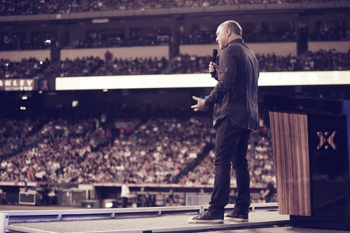 Evangelist Greg Laurie delivers the message of hope in Jesus Christ during the last night of 2014 SoCal Harvest before an overflow capacity crowd of 47,000 at Angel Stadium in Anaheim, Aug. 17, 2014.