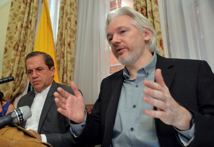 WikiLeaks founder Julian Assange (R) speaks as Ecuador's Foreign Affairs Minister Ricardo Patino listens, during a news conference at the Ecuadorian embassy in central London, England, Aug. 18, 2014. Assange, who has spent over two years inside Ecuador's London embassy to avoid extradition to Sweden, said on Monday he planned to leave the building 'soon,' without giving further details.