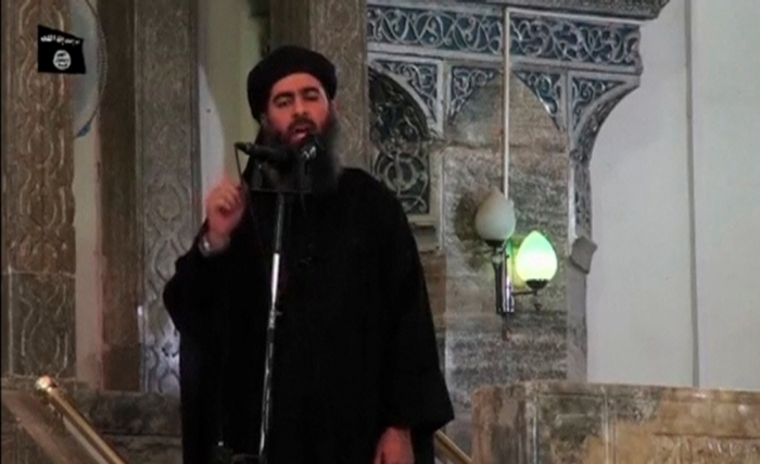 A man purported to be the reclusive leader of the militant Islamic State Abu Bakr al-Baghdadi has made what would be his first public appearance at a mosque in the center of Iraq's second city, Mosul, according to a video recording posted on the Internet on July 5, 2014, in this still image taken from video. There had previously been reports on social media that Abu Bakr al-Baghdadi would make his first public appearance since his Islamic State in Iraq and the Levant changed its name to the Islamic State and declared him caliph. The Iraqi government denied that the video, which carried Friday's date, was credible. It was also not possible to immediately confirm the authenticity of the recording or the date when it was made.