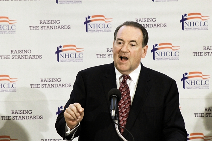 Former Arkansas Republican Gov. Mike Huckabee addresses the media after the NHCLC luncheon in Washington, Aug. 22, 2014.