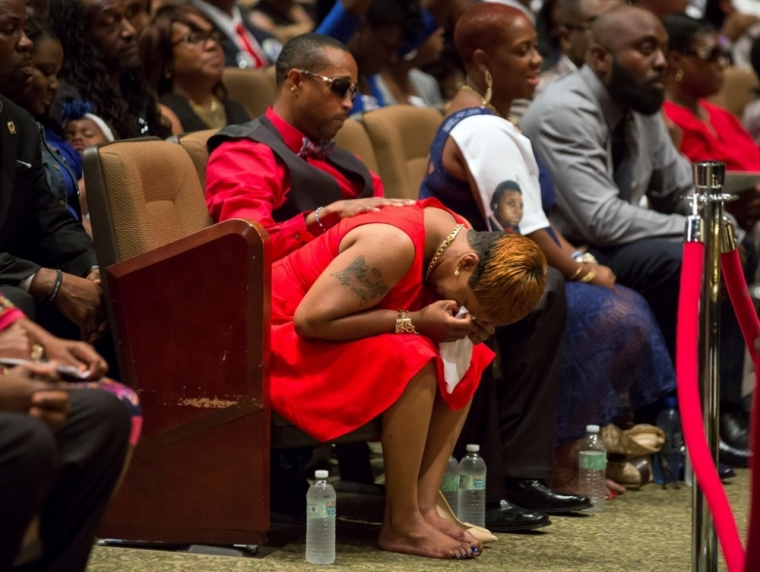 Lesley McSpadden, mother of Michael Brown, reacts during her son's funeral services at Friendly Temple Missionary Baptist Church in St. Louis, Aug. 25, 2014. Family, politicians and activists gathered for the funeral on Monday following weeks of unrest with at times violent protests spawning headlines around the world focusing attention on racial issues in the United States.