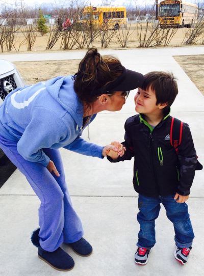 Sarah Palin leans in for a kiss from her son, Trig, who is diagnosed with Down syndrome.
