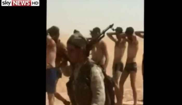 Video footage posted on Aug. 28, 2014 appears to show Syrian soldiers captured and forced to march in their underwear by IS militants.