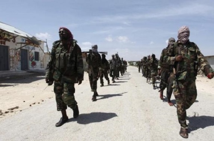 Al Shabaab soldiers patrol in formation along the streets of Dayniile district in Southern Mogadishu, March 5, 2012.