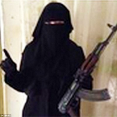 In a photo posted to the Umm Hussain al-Britani Twitter account, a female is brandishing an AK-47. The photo is believed to be of British mother of two, Sally Jones, who fled to Syria to join Islamic State terror group.