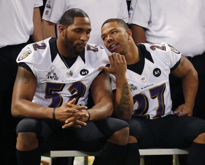 Baltimore Ravens running back Ray Rice talks to former teammate Ray Lewis (52) as they pose for their team picture during Media Day on January 29, 2013.
