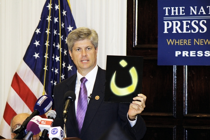 Speaking at the In Defense of Christians Press Conference at the National Press Club in Washington, D.C., U.S. Rep. Jeff Fortenberry holds up the Arabic letter 'N' pronounced 'noon' which stands for the word Nazarenes, which is used as a Arabic derogatory term for Christians. Islamic State forces have been spray painting the letter in 'blood red' marking the homes or businesses of Christians in Mosul, Iraq.