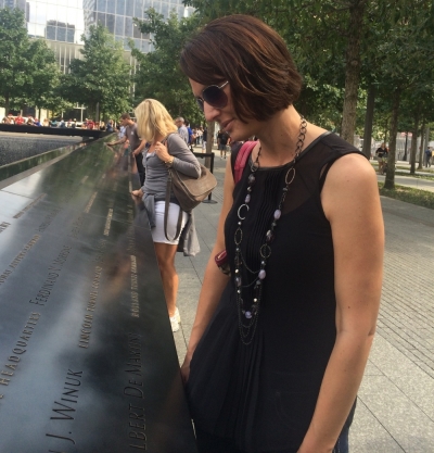 Lisa Graphenteen, of Minnesota observes the names of the victims at one of the Memorial pools at the National 9/11 Memorial in downtown, New York City, Sept. 10, 2014.