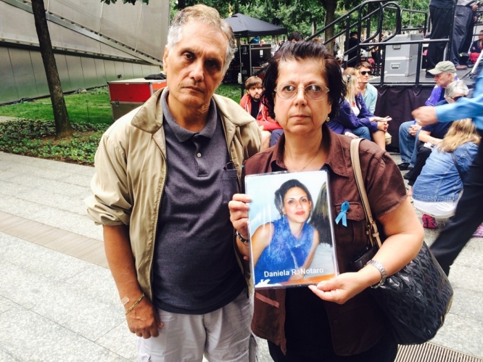 Carlo Notaro (L) and his wife, Rosa, pose with a picture of their daughter on the Memorial plaza at the National September 11 Memorial & Museum in downtown, New York City on Thursday, Sept. 11, 2014. Daniela died while working as a receptionist on the 92nd floor of the north tower on 9/11.