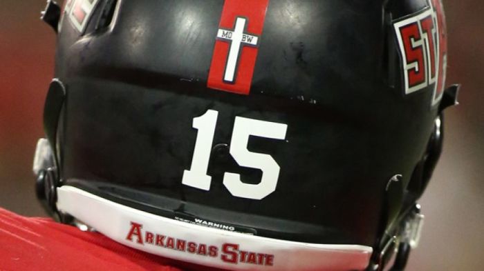 The football team at Arkansas State University will remove the cross decal on their helmets after a complaint was filed that it violated separation of church and state laws, September 2014.