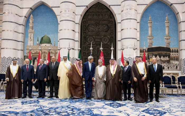 U.S. Secretary of State John Kerry (C) poses with his Arab counterparts during a family photo session with the Gulf Cooperation Council and regional partners at King Abdulaziz International Airport's Royal Terminal in Jeddah September 11, 2014. Kerry said on Thursday Arab states would play a critical role in a coalition against Islamic State militants in Iraq and Syria, but no country in the alliance was talking about sending ground troops to participate.