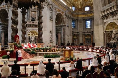 Pope Francis officiates a mass at the wedding of 20 couples in St.Peter's Basilica at the Vatican, Rome, Italy, Sept. 14, 2014.