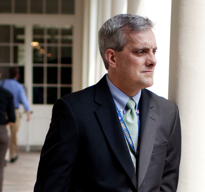White House Chief of Staff, Denis McDonough, takes a walk outside of the White House. McDonough told Fox News Sunday that the Obama administration did no threaten the families of the slain American journalist but reminded them of the U.S. laws against providing 'material support' to terrorist groups.