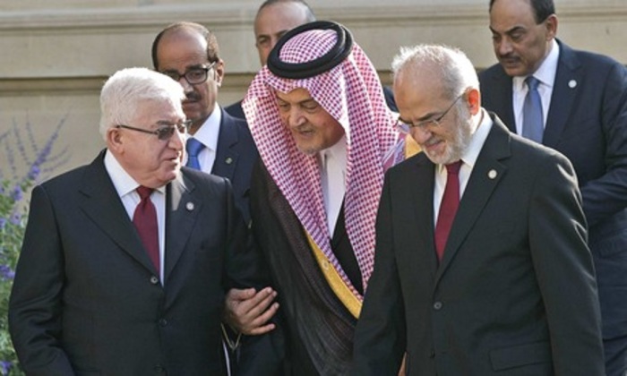 Iraq's President Fouad Massoum talks with Saudi Arabian foreign minister Prince Saud al-Faisal and Iraqi foreign minister Ibrahim al-Jaafari at the International Conference on Peace and Security in Iraq; Paris, France, Monday, Sept. 15, 2014.