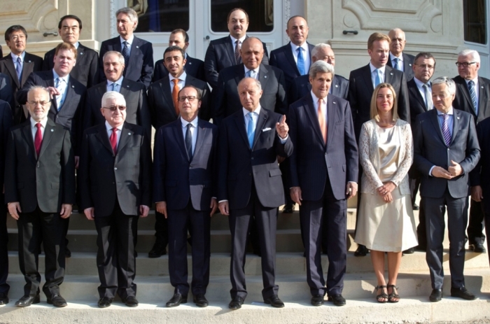 Iraq's President Fuad Masum (2ndL), French President Francois Hollande (3rdL), French Foreign Minister Laurent Fabius (C) and U.S. Secretary of States John Kerry (3rdR) pose for a family photo during the International Conference on Peace and Security in Iraq, at the Quai d'Orsay in Paris, France, Sept. 15, 2014. French President Hollande called on Monday for a global response to counter Islamic State militants during an International conference bringing together about 30 countries to discuss how to cooperate in the fight against Islamic State militants, saying the group posed a security threat the world over.