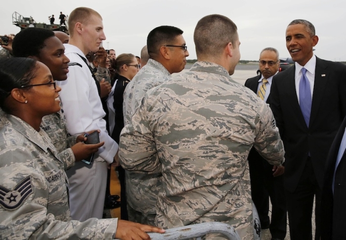 US President Barack Obama shakes hands after he arrives at MacDill Air Force Base in Tampa, Florida September 16, 2014.