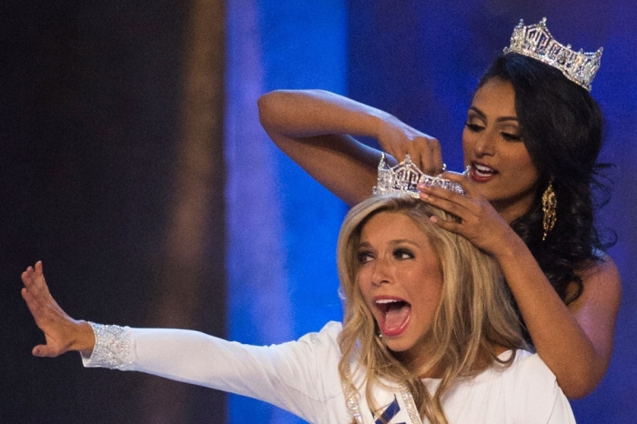 Miss New York Kira Kazantsev (front) reacts as she is crowned the winner of the 2015 Miss America Competition by Miss America 2014 Nina Davuluri in Atlantic City, New Jersey September 14, 2014.