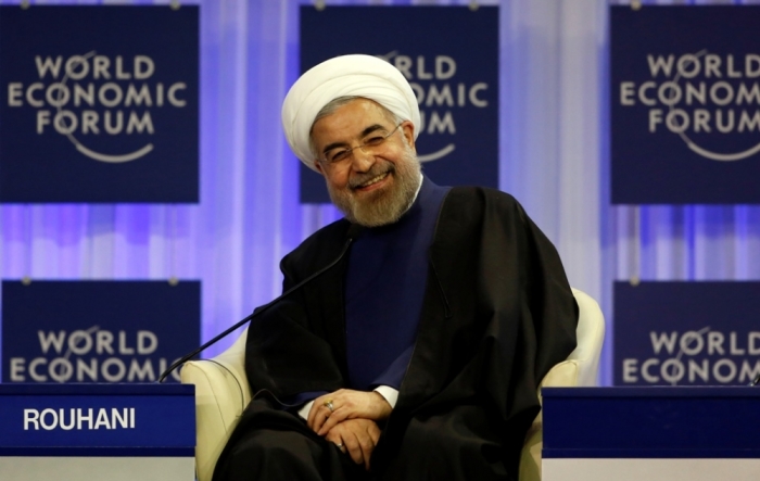 Iran's President Hassan Rouhani smiles during a session at the annual meeting of the World Economic Forum in Davos, Switzerland, Jan. 23, 2014.