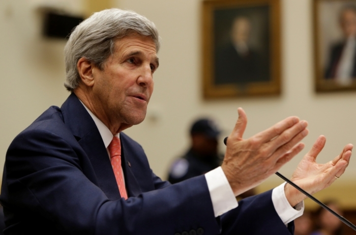 U.S. Secretary of State John Kerry testifies before a House Foreign Affairs Committee hearing on 'The ISIS Threat: Weighing the Obama Administration's Response' on Capitol Hill in Washington, September 18, 2014.
