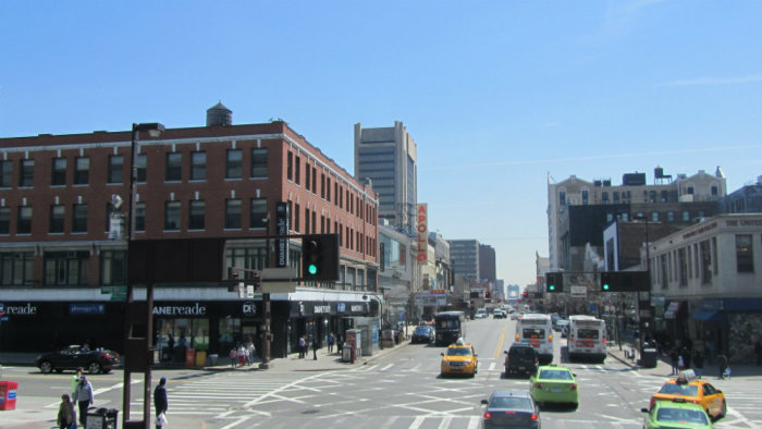The Apollo Theater's sign can be seen on 125th Street in Harlem, NYC.