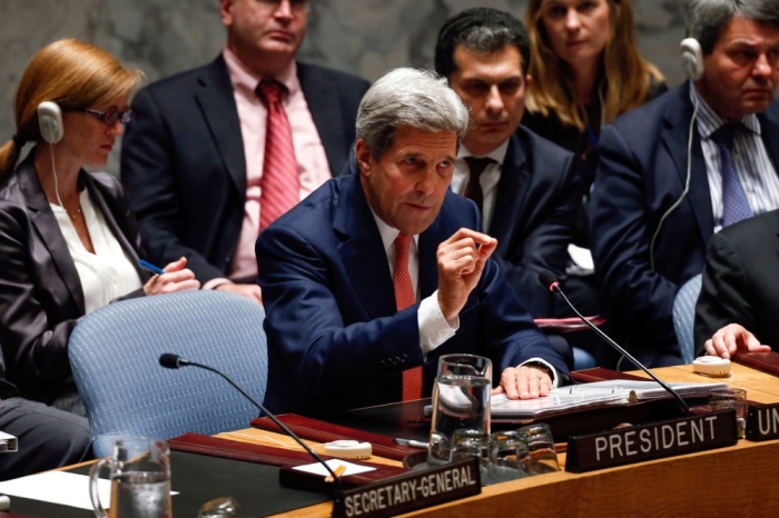 U.S. Secretary of State John Kerry gestures during a United Nations Security Council meeting on Iraq at U.N. headquarters in New York, September 19, 2014.