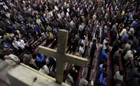 Worshippers pray during a mass at the Liuhe Catholic Church in Liuhe village on the outskirts of Qingxu county, northern China, in this undated photo.