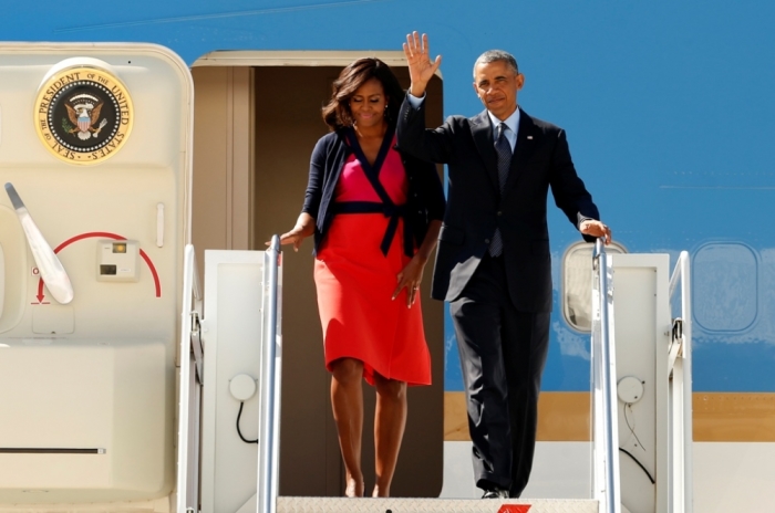 U.S. President Barack Obama and first lady Michelle Obama disembark from Air Force One as they arrive in New York to attend the United Nations General Assembly, September 23, 2014.