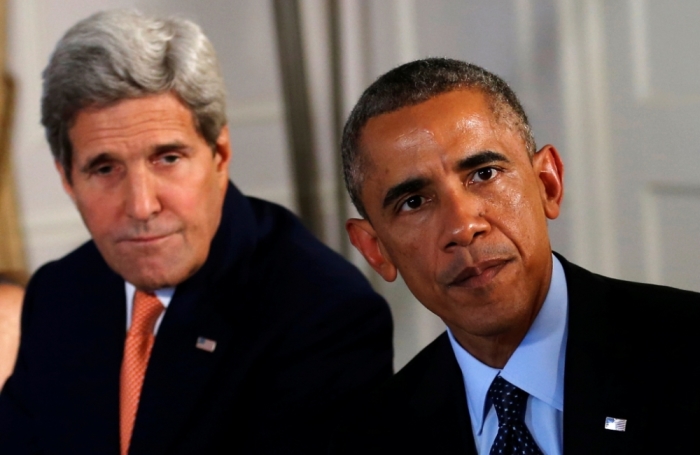 U.S. President Barack Obama and U.S. Secretary of State John Kerry meet in New York with representatives (not pictured) of the five Arab nations that contributed in air strikes against Islamic State targets in Syria, September 23, 2014. Representatives from Iraq were also at the meeting.
